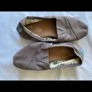gray TOMS slip ons
